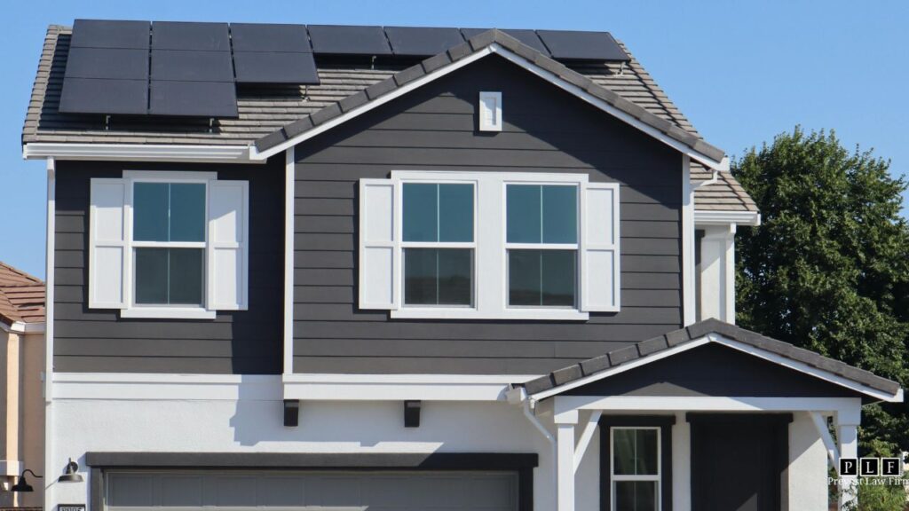 Grey house with solar panels on the roof. Adt Solar went out of business, leaving homeowners like this stranded.