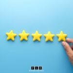 A hand lining up five stars for solar reviews